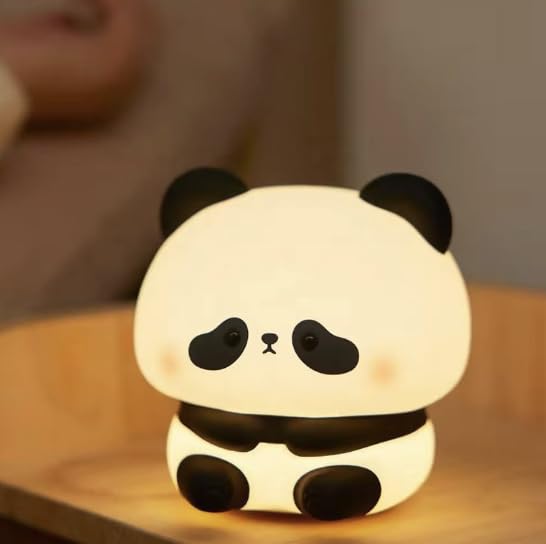 Soft touch LED panda nursery lamp, glowing warmly, perfect for children's bedrooms or as a baby night light. www.usmile.toys